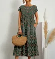 Détail d'une robe d'été en coton-lin avec imprimé floral et poches latérales utiles. - S / Grand Motif Floral Vert