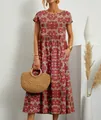 Gros plan sur une robe longue bohème à fleurs montrant la texture du tissu et une poche. - S / Fleur Rouge