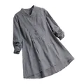 Detailed view of women's black and white checkered long sleeve blouse with stand collar - S / Tops / Black