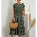 Loose green floral print cotton linen maxi dress with round neck and side pockets - S / Tops / Green Large Floral