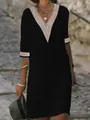 Close-up detail of V-neck lace trim on a casual black cotton linen midi dress. - Black