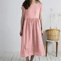 Detail view of the pink cotton linen midi dress showing pleated texture and loose fit - Pink