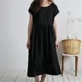 Elegant loose black cotton linen midi dress featuring a round neck and pleated waist detail. - Black