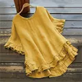 Primer plano de blusa de algodón y lino amarilla con volantes en mangas y dobladillo - S / Tops / Trigo