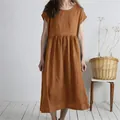 Detailed view of rust-colored loose cotton linen midi dress with pleated waist - S / Khaki