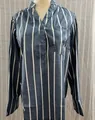 Detailed macro view of women's blue vertical striped long-sleeved blouse with V-neckline - S / Tops / Blue