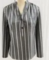 Close-up detail of a grey and white vertical striped women's shirt featuring a V-neck - S / Tops / Gray