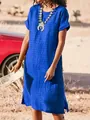 Full view of casual blue midi dress with side slits and textured fabric outdoors - Sapphire Blue