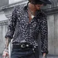 Detail view of men's long sleeve leopard print shirt with stylish lapel collar. - S / Tops / Black