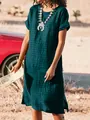 Woman wearing dark teal textured short sleeve dress with side slits in desert setting - S / Dresses / Dark Green
