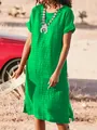 Casual green short sleeve dress for women featuring a round neck and side slit design. - Verdant