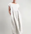 Detail showing the loose silhouette and sleeveless design of the white cotton linen dress - S / Top And Bottom / White