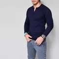Slim fit men's navy blue long sleeve cotton Henley T-shirt featuring a buttoned neck design - Navy Blue