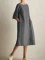 Close-up view of a comfortable loose-fit grey cotton linen dress with side pockets. - S / Tops / Gray