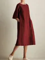Detail view of a burgundy cotton linen midi dress with a round neck and side pockets. - S / Tops / Burgundy