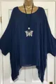 Detail showing the blue textured fabric and irregular hem of this oversized women top - Navy Blue