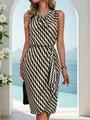 Full body view of a sleeveless dress with black and white wavy stripes in a scenic setting. - S / Dresses / Black
