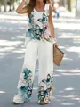 Detailed view of white two-piece set with vibrant butterfly and floral prints - S / Top And Bottom / Green