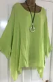Close-up of light green oversized blouse featuring irregular hem and textured fabric. - S / Tops / Green