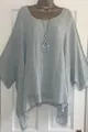 Front detail of a loose light blue textured cotton top featuring an irregular hem - S / Tops / Gray