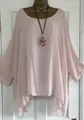 Light pink oversized linen top with irregular hem and wide sleeves shown on a mannequin - S / Tops / Pink