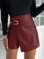 Detailed view of high-waisted burgundy PU leather shorts with silver metal buckle - S / Bottoms / Burgundy