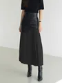 Elegant high-waisted patchwork pleated midi skirt in black faux leather and fabric - S / Bottoms / Black