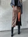 Fashionable brown faux leather midi skirt with a sexy high side slit and slim fit design. - M / Bottoms / Brown