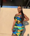 Detailed view of a sexy bodycon cami dress featuring a vibrant colorful camo print - S / Bottoms / Multicolor 2