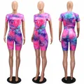 Front, side, and back view of vibrant pink and purple tie-dye two-piece set with biker shorts - S / Top And Bottom / Colorful Purple