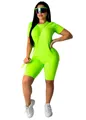 Vibrant neon green two-piece women's fitness set featuring crewneck T-shirt and biker shorts - Fluorescent Green