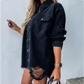 Side view of a mid-length black distressed denim jacket with shredded hem - S / Tops / Black