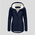 Detail view of navy blue women's parka showing the thick white sherpa fleece hood - S / Tops / Navy Blue