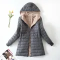 Detailed view of women's gray quilted jacket with warm beige sherpa lining - S / Tops / Gray