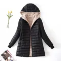 Detailed view of women's black hooded jacket with warm beige sherpa fleece lining. - S / Tops / Black
