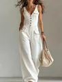 Detail shot of white denim sleeveless wide-leg jumpsuit with cargo pockets and button front. - S / Top And Bottom / White