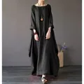 Full-body shot of a woman in a black loose-fitting linen maxi dress with long sleeves. - L / Top And Bottom / Black