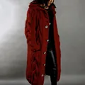 Close-up detail of a chunky cable knit long hooded cardigan in an elegant rust red color - S / Red Brown