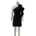 Elegant black satin mini dress with oversized side bows on a mannequin display - XS / Tops / Black