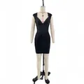 Detailed view of a black V-neck sleeveless knit bandage evening dress on a mannequin - Black