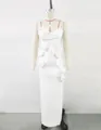 Detail view of a white French-style floor-length dress with elegant 3D floral accents. - S / Tops / White