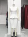 Detail of white bandage two-piece set featuring a peplum top and slim bodycon skirt - XS / Top And Bottom / White