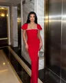 Full length view of an elegant red bandage dress featuring a sparkling rhinestone trim. - S / Red
