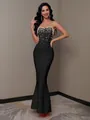 Detailed view of a black strapless mermaid bandage dress with elegant pearl embellishments - XL / Top And Bottom / Black