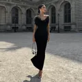Elegant black evening gown with ostrich feather trim and slim fit silhouette for events. - S / Top And Bottom / Black