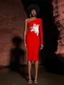 Close-up detail of red one-shoulder bandage dress with white lace flower and waist cutout - S / One Shoulder Long Sleeve Style / Red