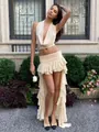 Elegante conjunto beige de dos piezas con top corto halter y falda larga con volantes - XS / Top Y Pantalón / Albaricoque