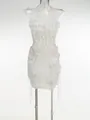 Detalle del conjunto de dos piezas blanco con top halter de volantes y minifalda floral - XS / Top Y Pantalón / Blanco
