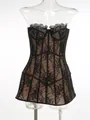 Close-up detail of a sexy black floral lace corset dress featuring sheer mesh boning - XS / Top And Bottom / Black