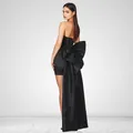 Elegant black strapless mini dress with a stunning detachable oversized bow trail - XS / Black